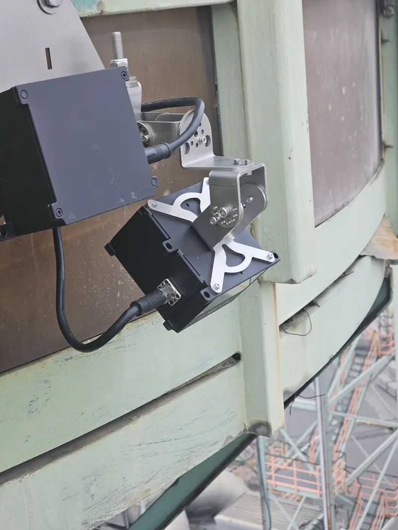 OWL EYE® dual Livox HAP LiDAR sensors mounted on a green steel structure above a slag stockpile at a steel plant